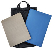 Two rectangular mats, one beige and one blue, with a black bag on a white background.