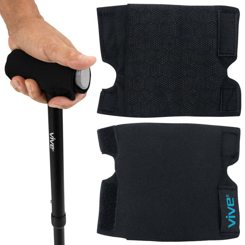 Black Vive walking stick with hand grip and knee pads on a white background