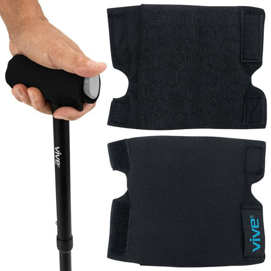 Black Vive walking stick with hand grip and knee pads on a white background