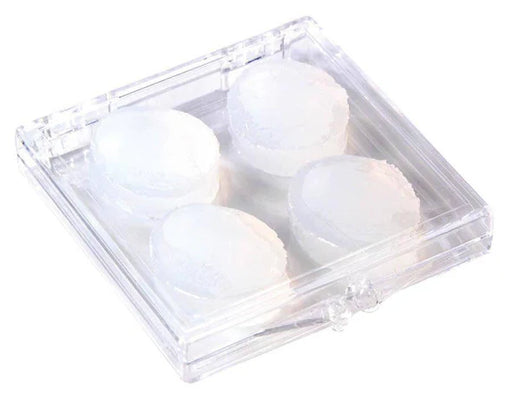 Clear plastic container with four white ear plugs on a white background