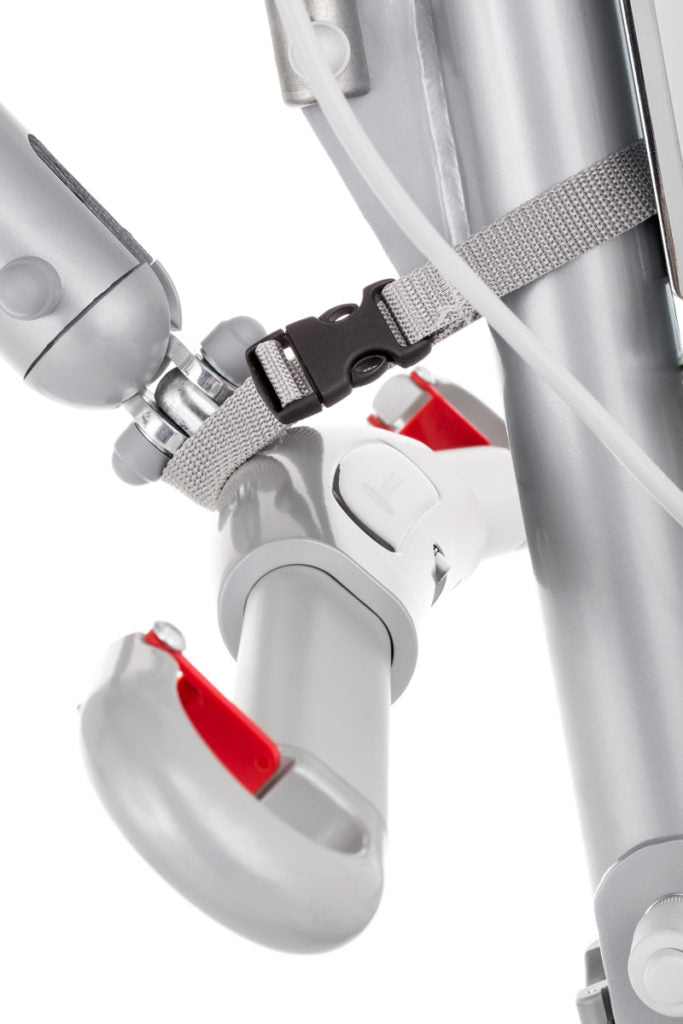 Close-up of a medical or industrial robotic arm with a gray wrist attachment secured by a gray strap and black quick-release buckle, on a white background.