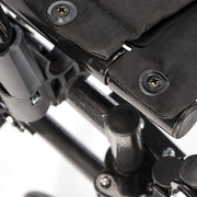 Close-up of a black and gray mechanical or technical component with screws.