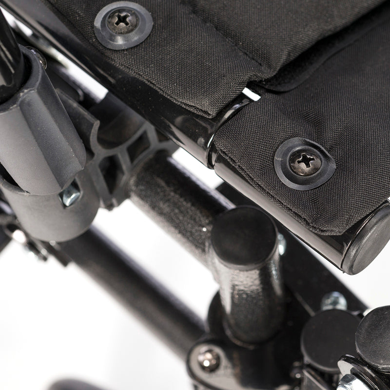 Close-up of a black and gray mechanical or technical component with screws.