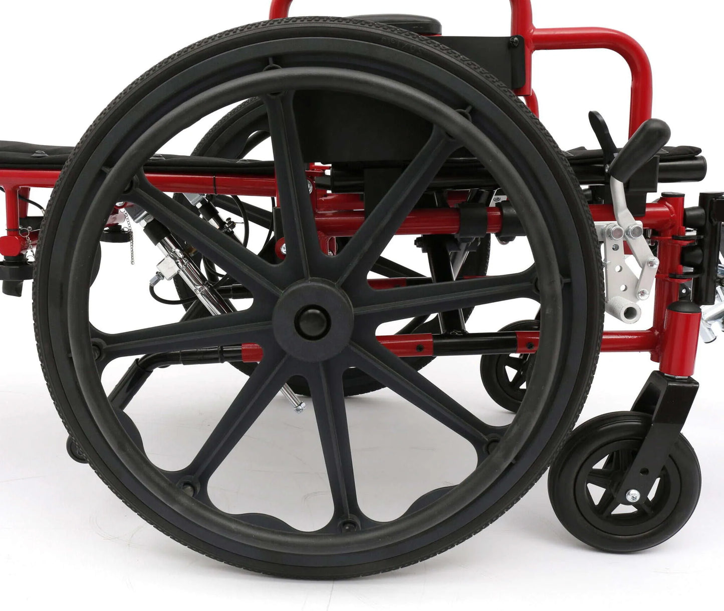 Close-up of a wheelchair with black wheels on a white background
