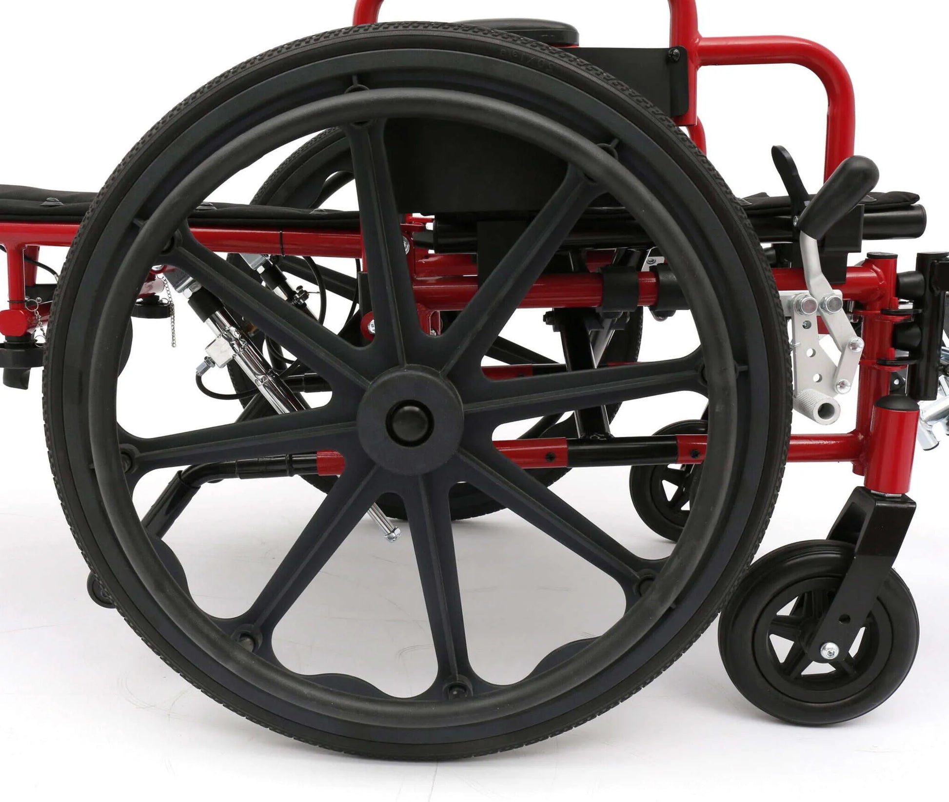 Close-up of a wheelchair with black wheels on a white background