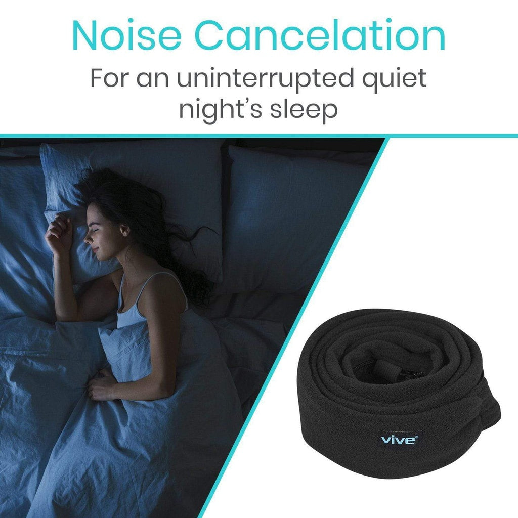 Woman lying in bed with noise cancellation product next to her