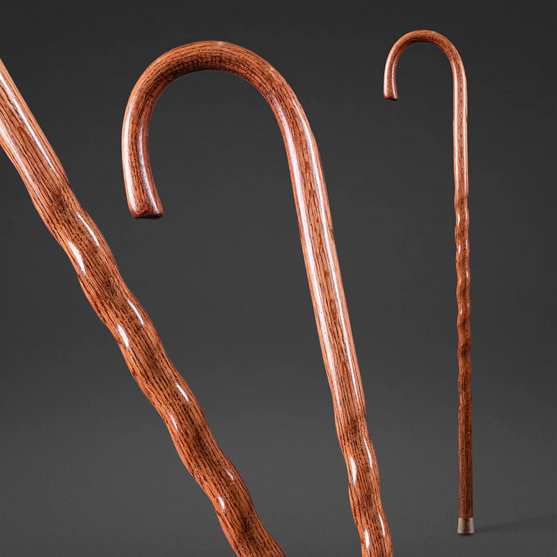 Two wooden walking canes on a dark background