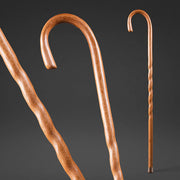 Two wooden canes on a dark background