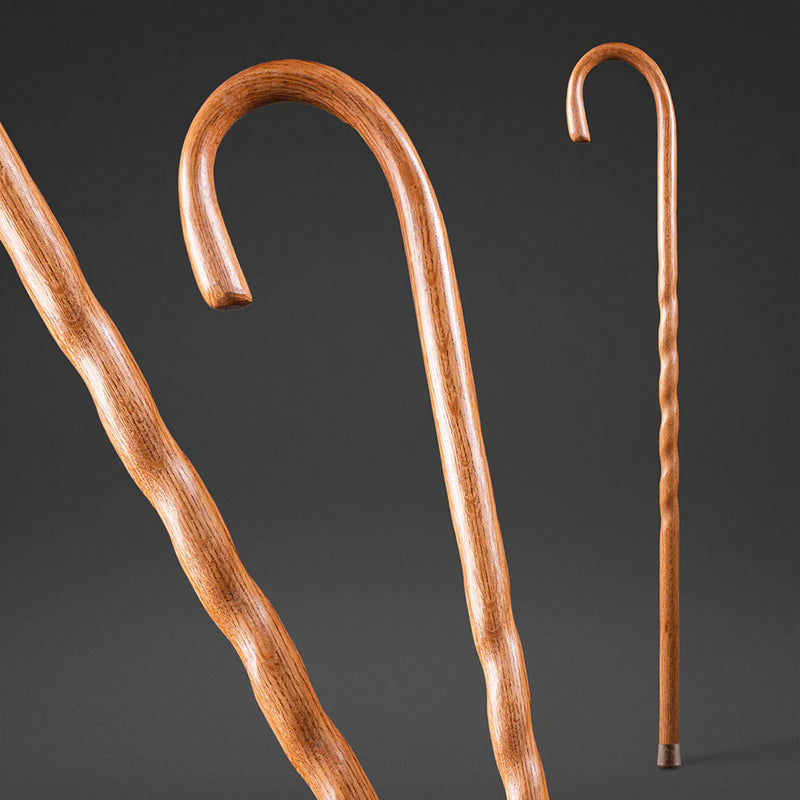 Two wooden canes on a dark background