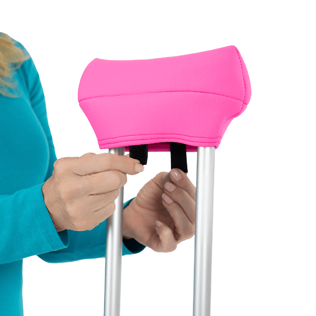 pink crutch pad being attached