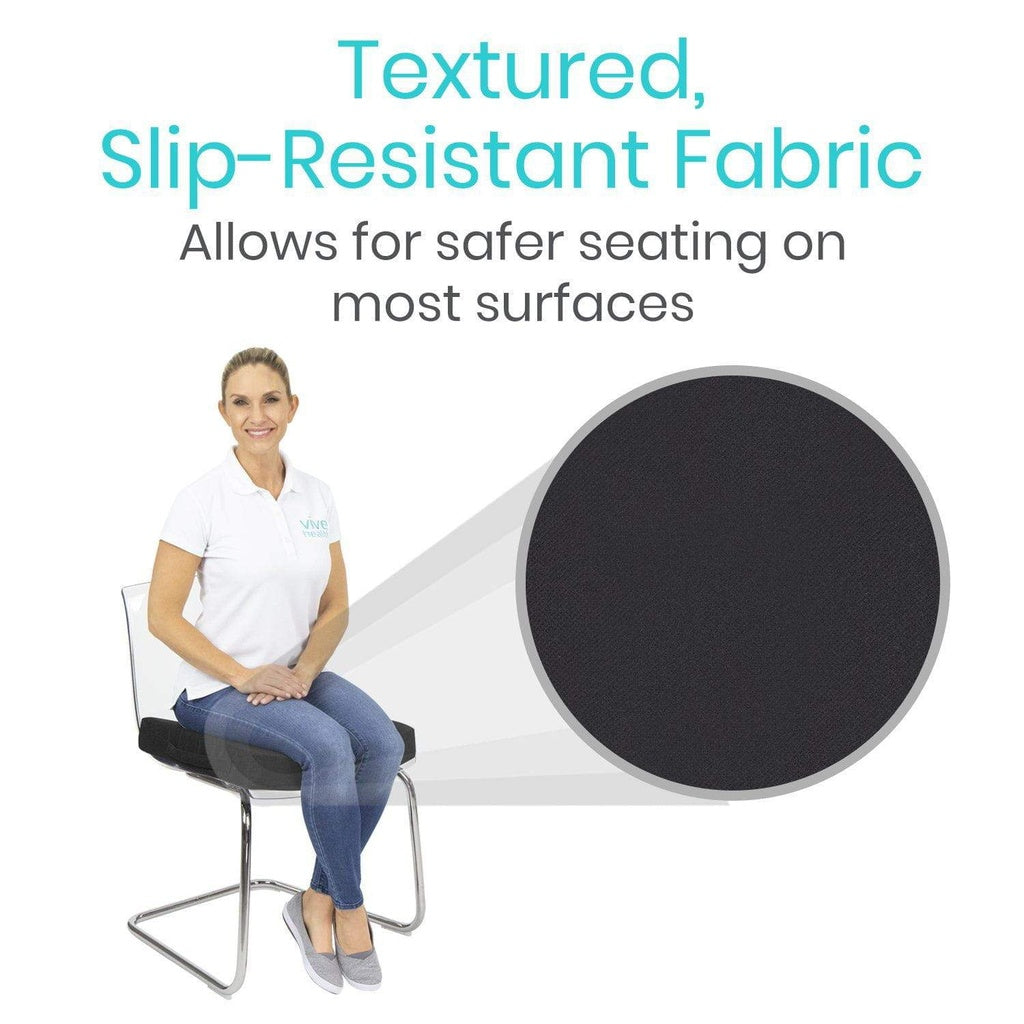 Woman sitting on a chair with a textured, slip-resistant fabric sample next to her.