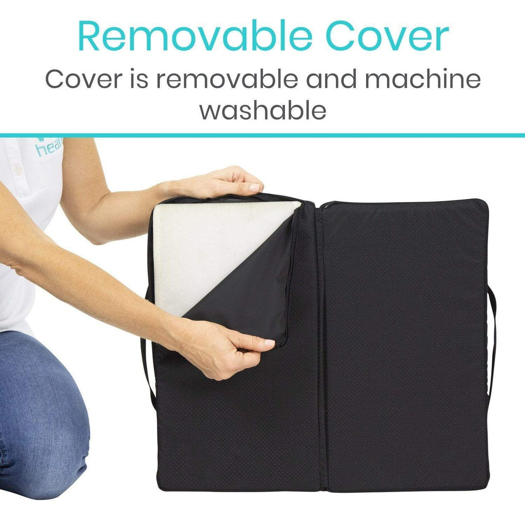Person holding a black cover with a white interior, showing its removable nature.