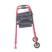 Red walker with wheels and a bag on a white background