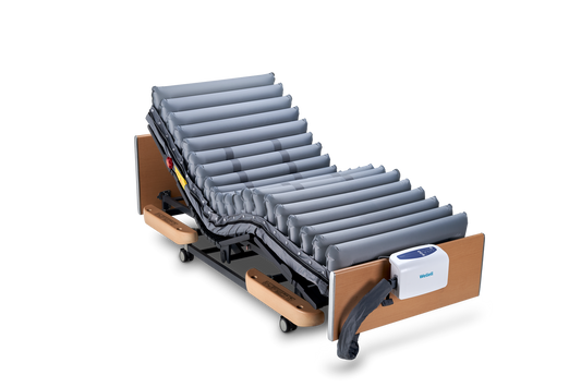 Electric adjustable hospital bed with air囊technology on a white background