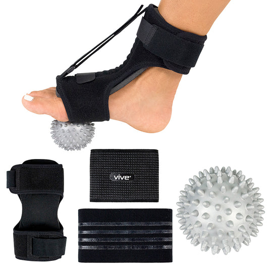 Foot care product set with black straps, spiky ball, and Vive packaging on a white background