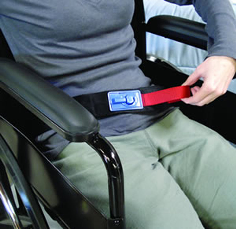 Person in a wheelchair using a safety belt with a visible brand label.