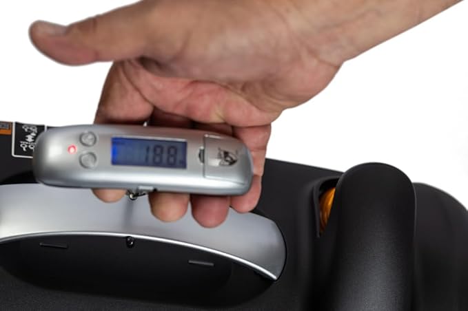 Hand holding a digital luggage scale displaying weight, with a white background