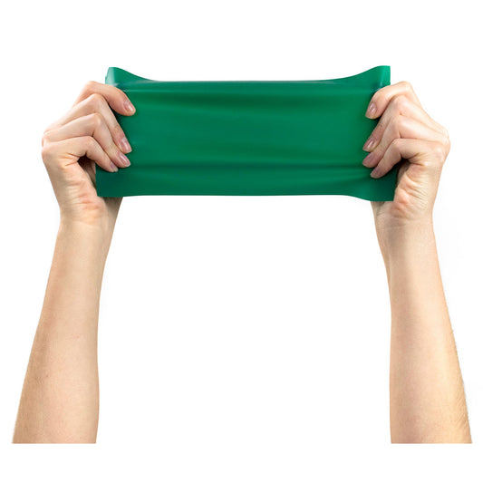 Green resistance band held by hands on a white background