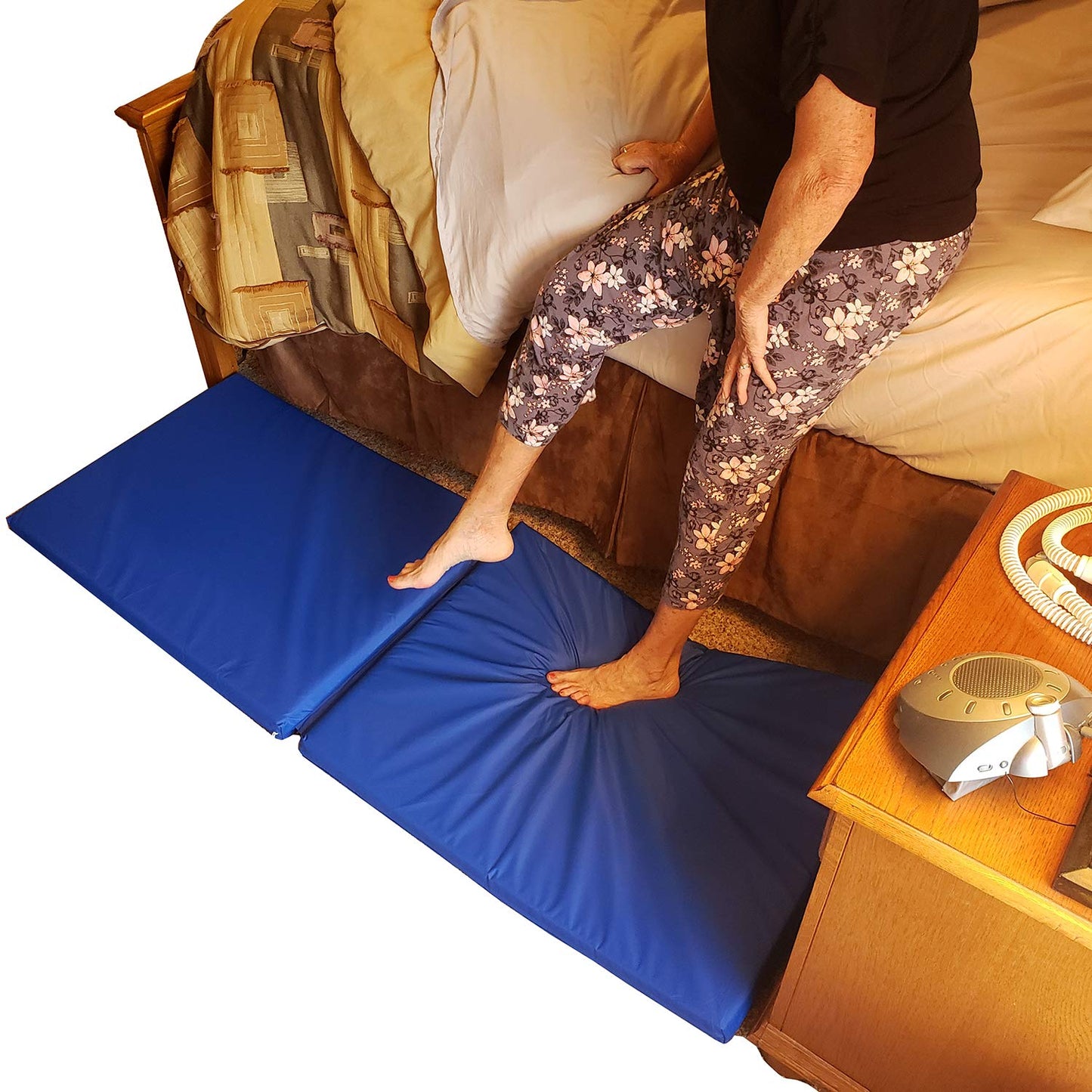 woman getting out of bed onto fall mat