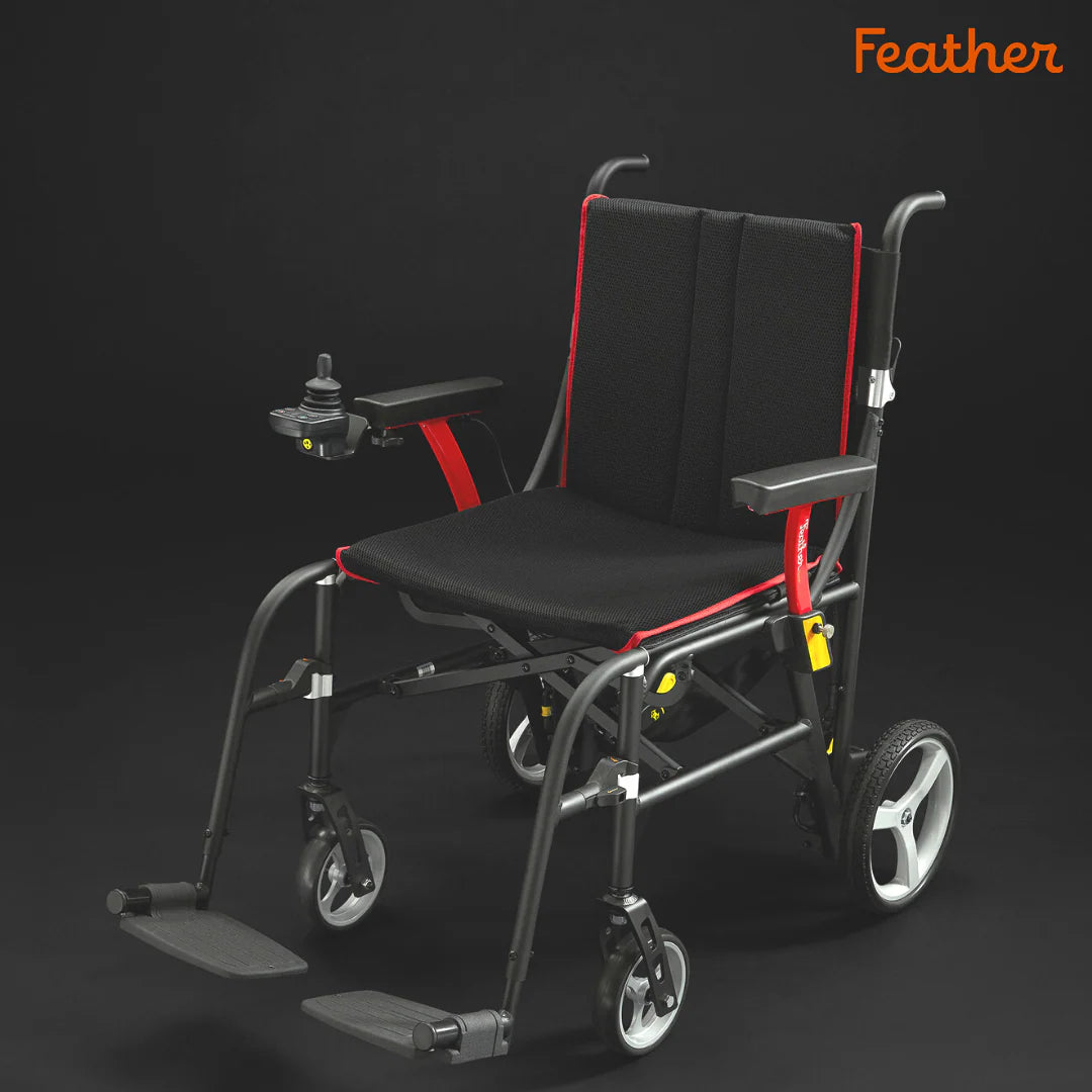 Black and red wheelchair with 'Feather' branding on a dark background