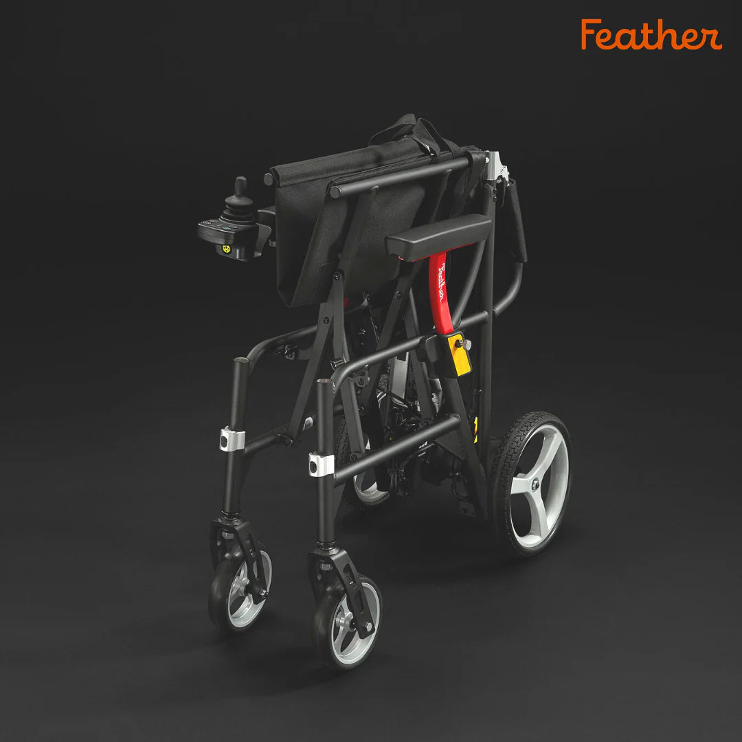 Black rollator with red accents on a dark background, featuring the brand 'Feather'.