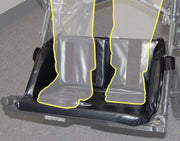 Black and gray vehicle step with transparent cover on a gray floor