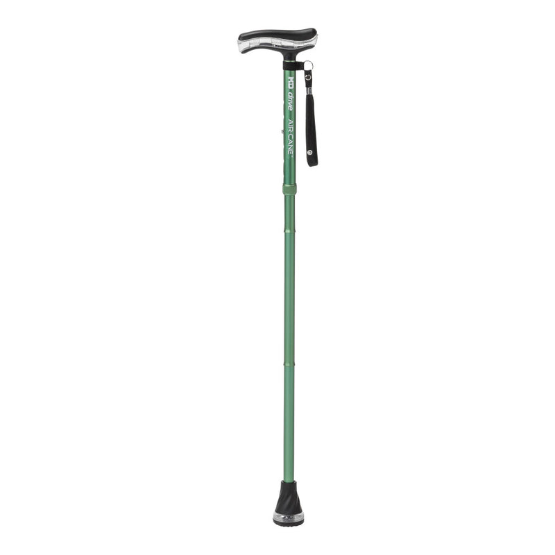 Green walking cane with black foot and handle on a white background