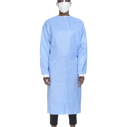 Person wearing a blue medical gown and face mask on a white background