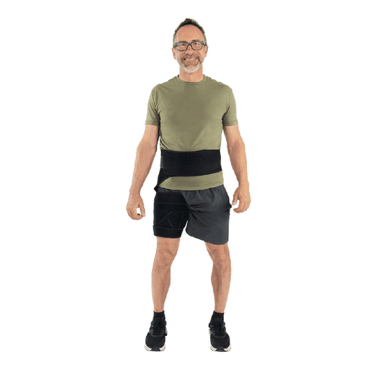 Man wearing a green t-shirt and black shorts on a white background