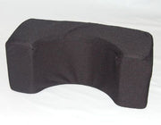 Black wedge-shaped pillow on a white background