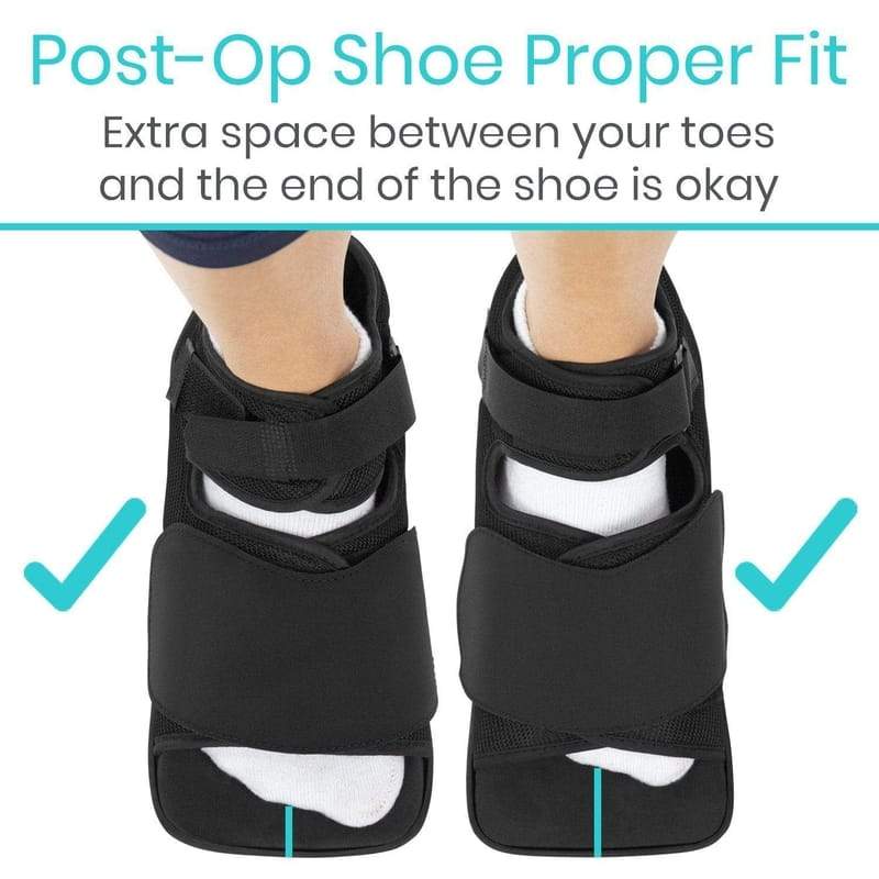 Black post-op shoe with extra space between toes and shoe end, on a white background.