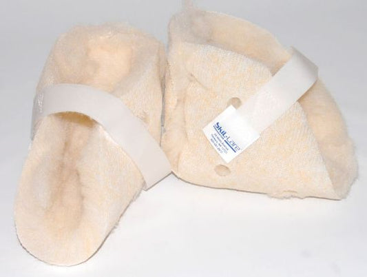 Pair of beige heel protectors with a white strap on a light gray background