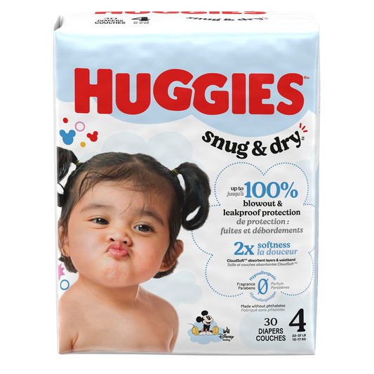 Huggies snug & dry diaper package with a child's face on it