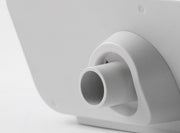Close-up of a white cylindrical object on a light gray background