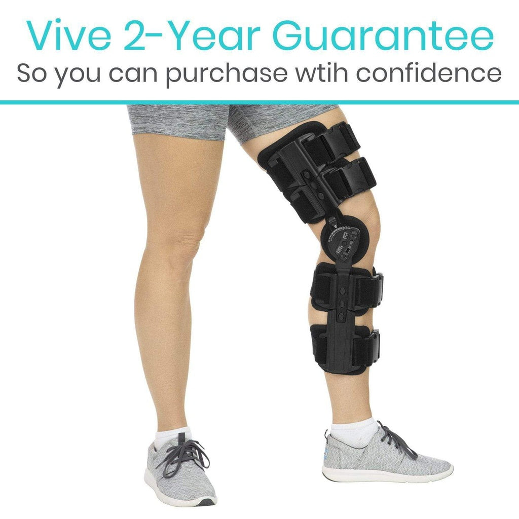 Person wearing a black knee brace with 'Vive 2-Year Guarantee' text above on a white background