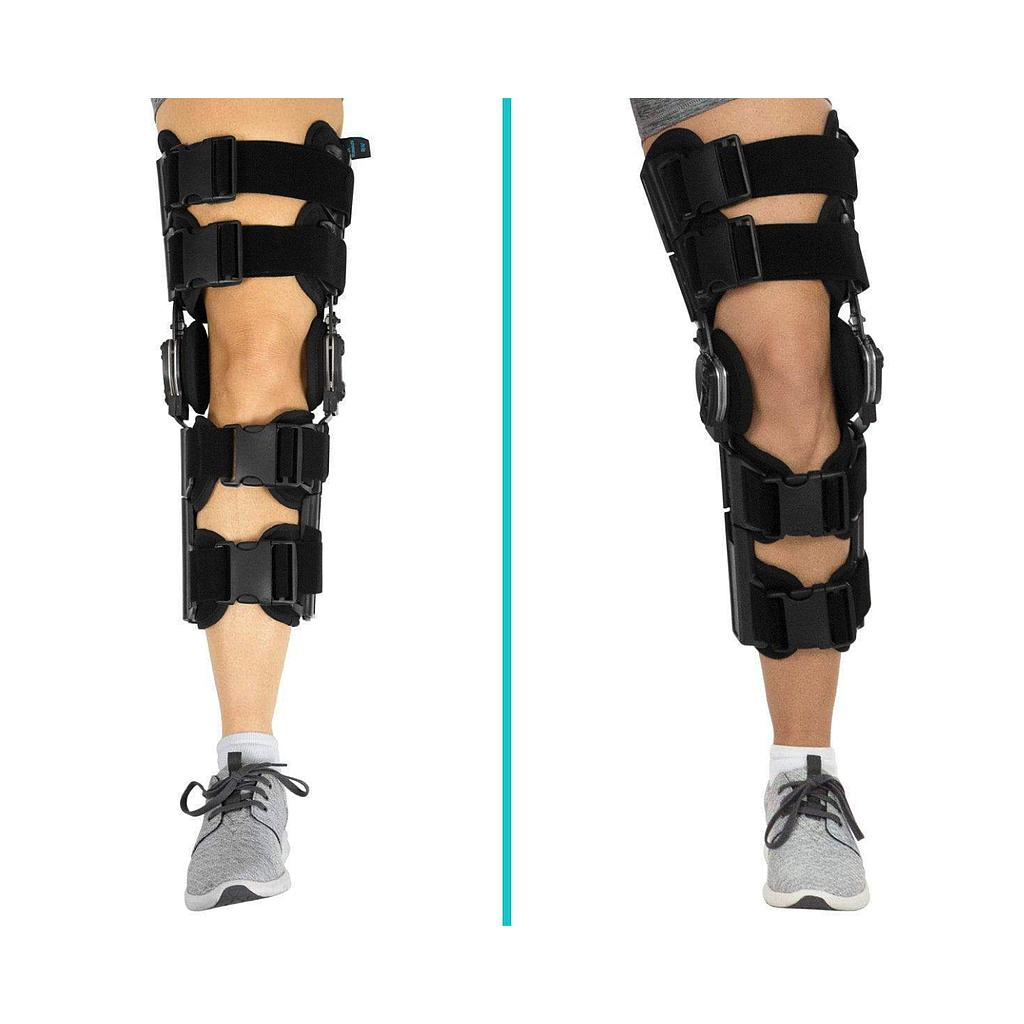 Black knee brace on a person's leg with a white background