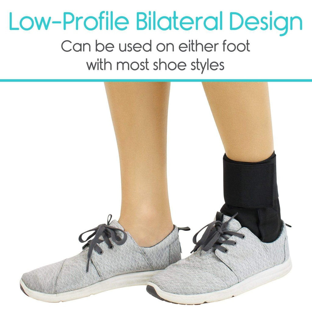 Gray sneakers with a black ankle support brace on a white background
