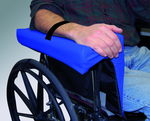 Person using a wheelchair with a blue cushion on the seat
