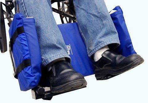 Blue leg coverings on a person using a wheelchair