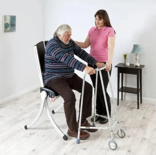 man using chair to get to walker