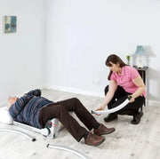 man lying on floor on chair 