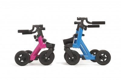 Two balance bikes, one pink and one blue, on a white background