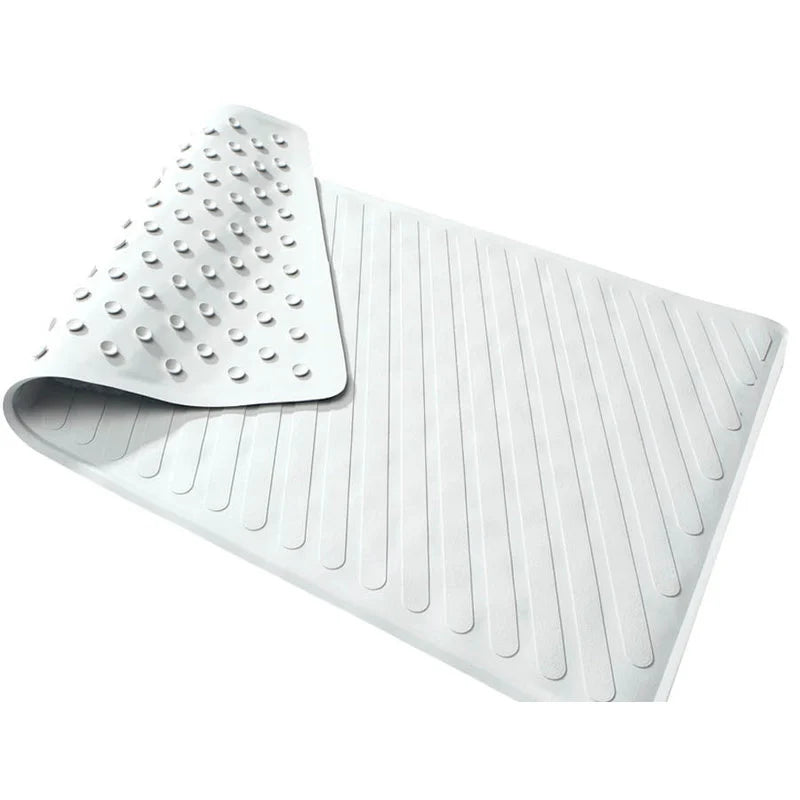 White rubber bath mat with textured patterns on a white background