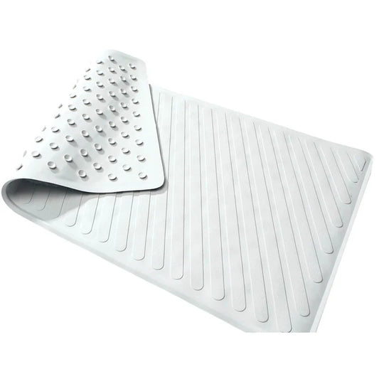 White rubber bath mat with textured patterns on a white background