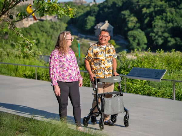 man walking with maverick rollator