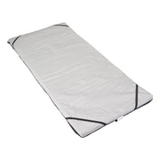 White sleeping bag with black zipper on a white background
