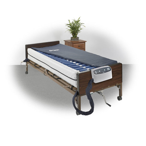 Electric hospital bed with mattress on a white background