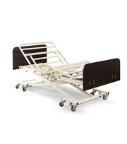Electric hospital bed with adjustable features on a white background