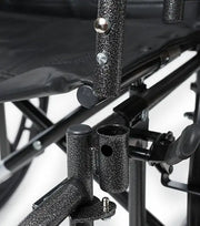 Close-up of a black metal chair with textured armrests and legs on a white background