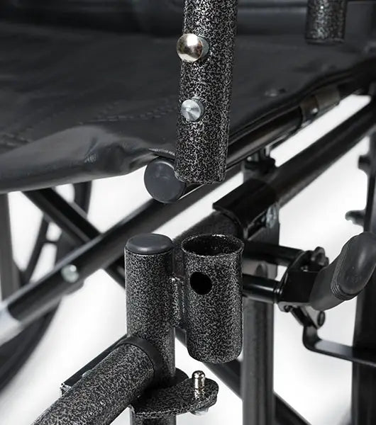 Close-up of a black metal chair with textured armrests and legs on a white background